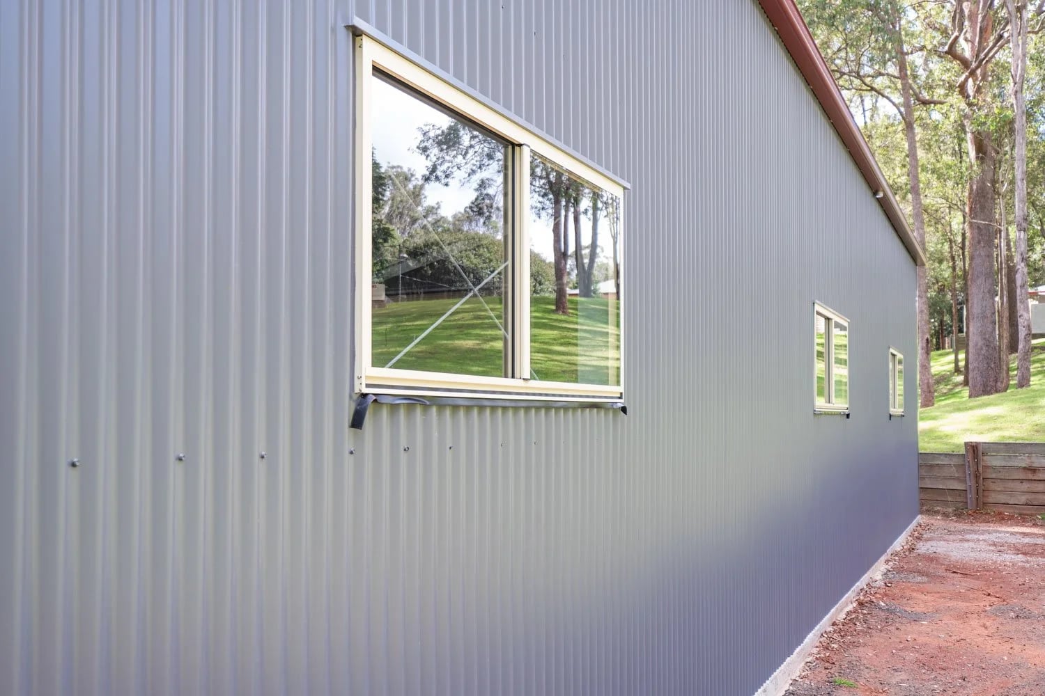 Multiple Windows — Acreage Shed Complements Country Life