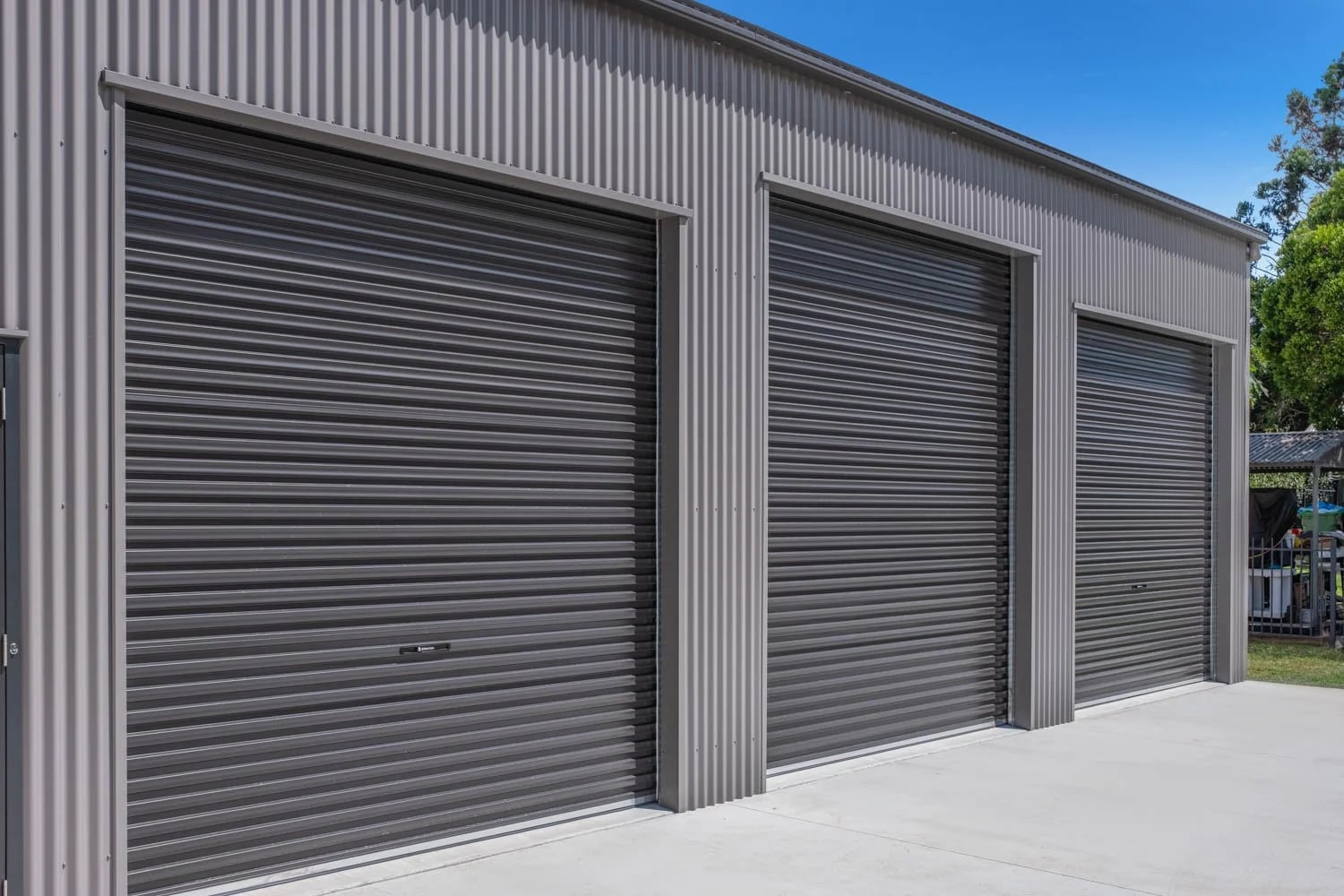 Four Steel-Line Roller Doors — A Custom Workshop Shed in Brassall