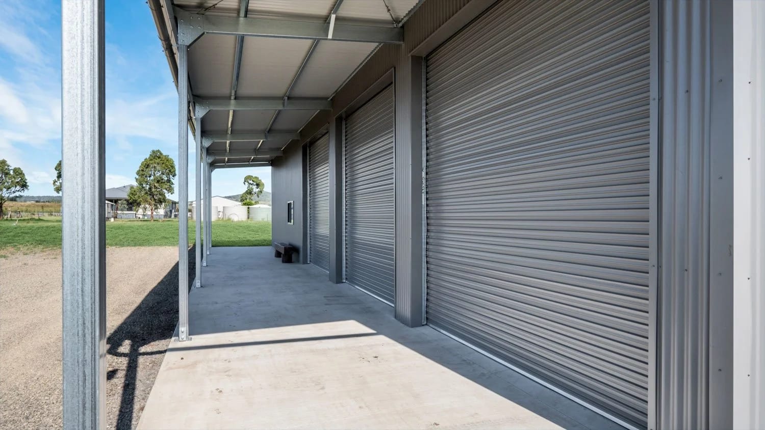 Three Roller Doors for Access Efficiency — A Farm Shed in Westbrook