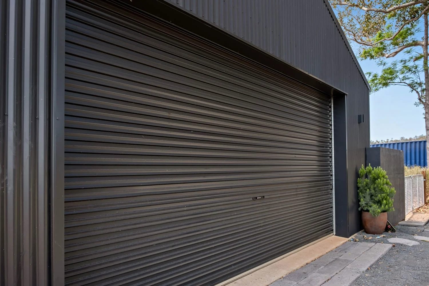 Steel-Line Roller Door — Lifestyle Shed in a Rural Setting