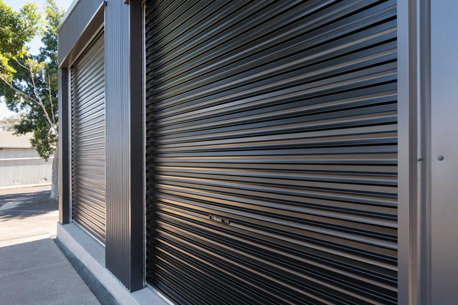three roller doors on a shed