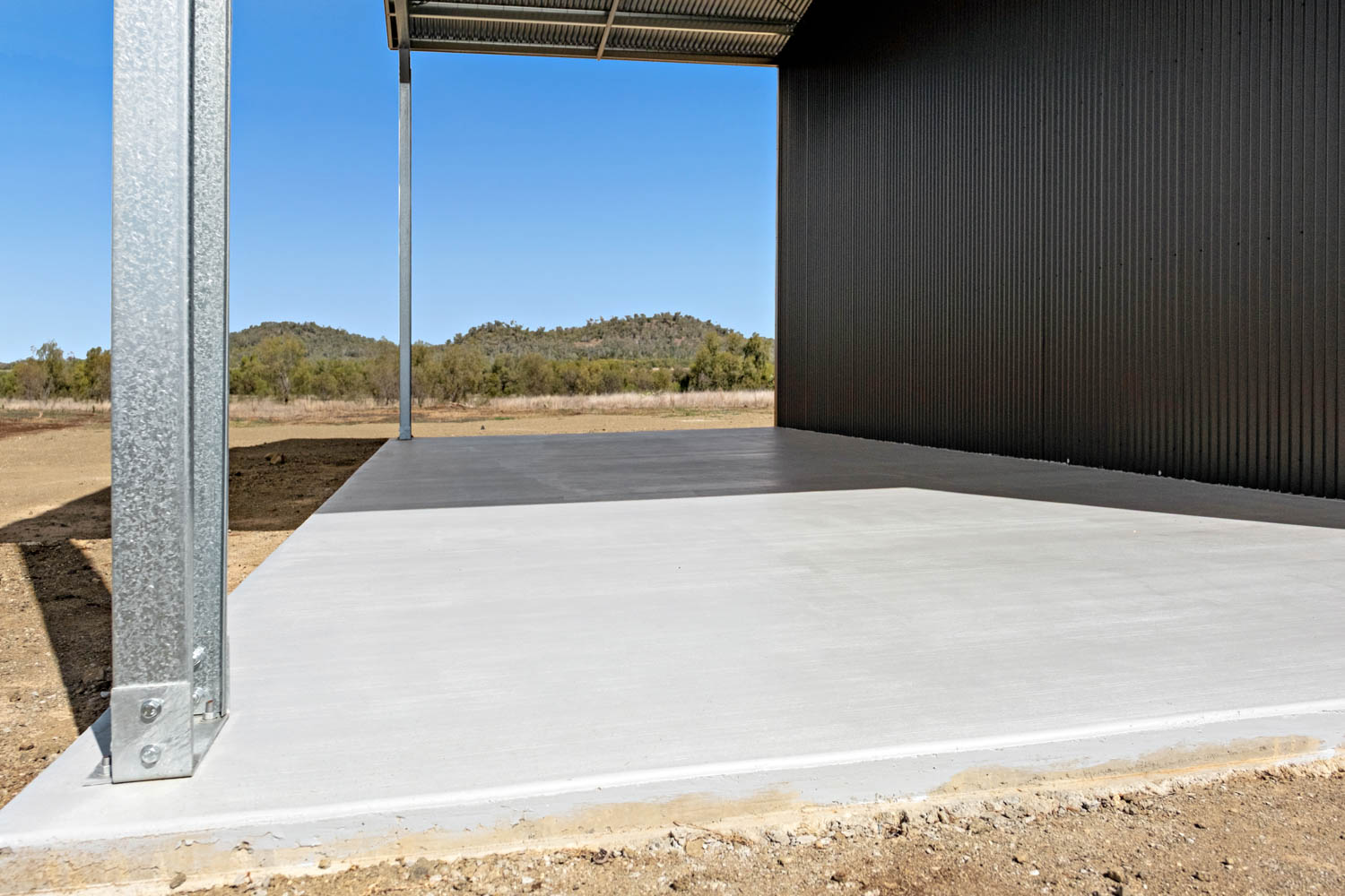 solid concrfete slab on a busy farm shed