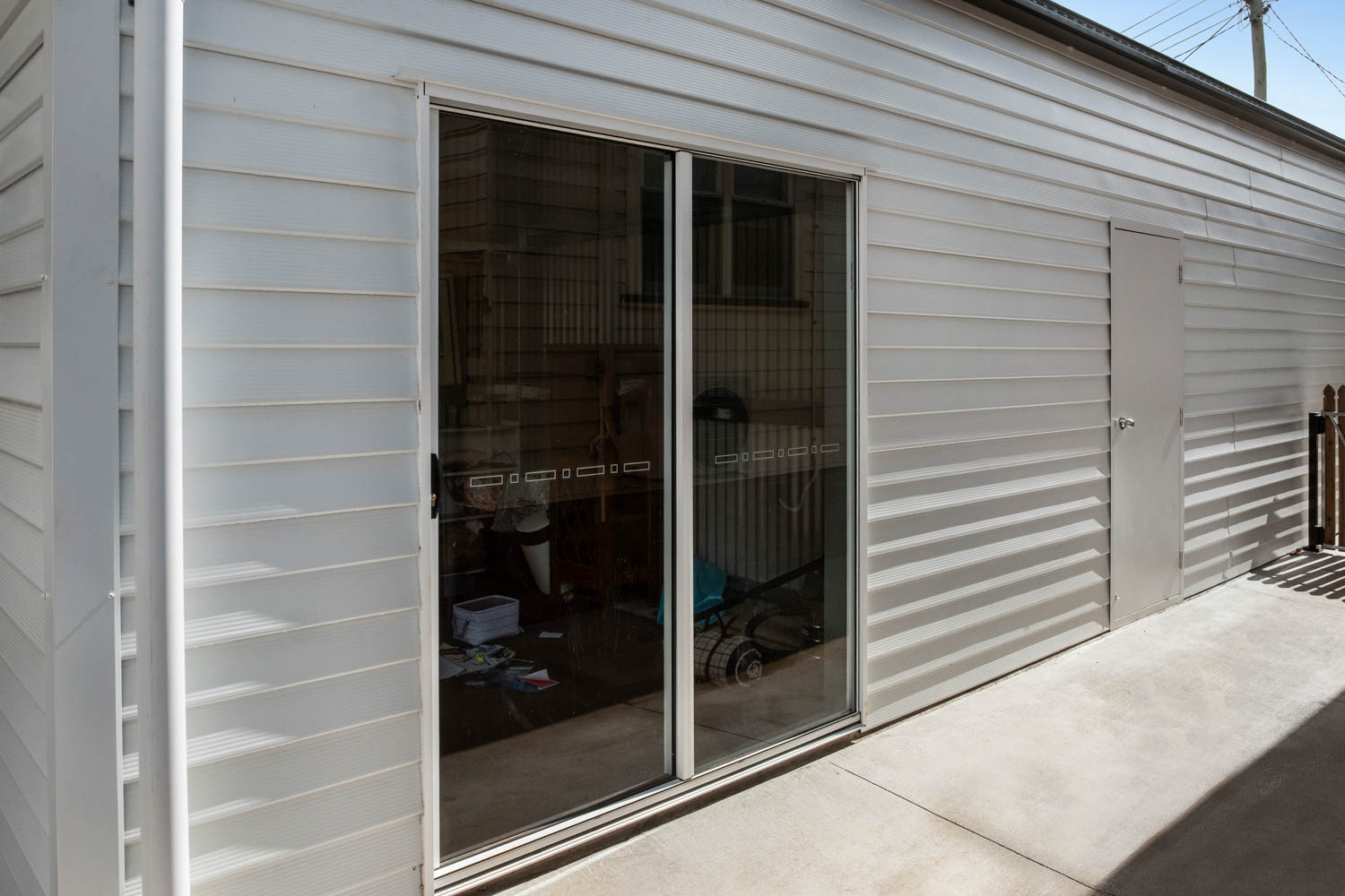 shed office with sliding glass door
