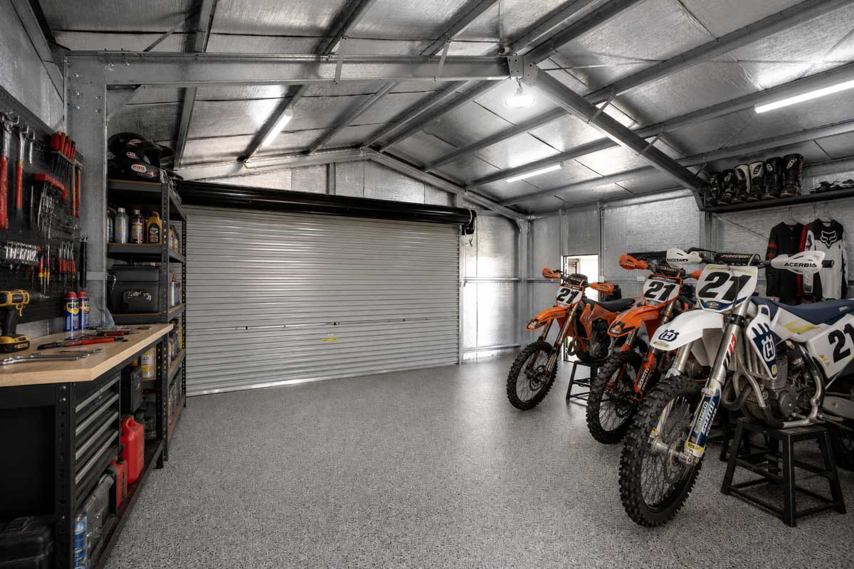 dirt bikes and tools in a residential shed