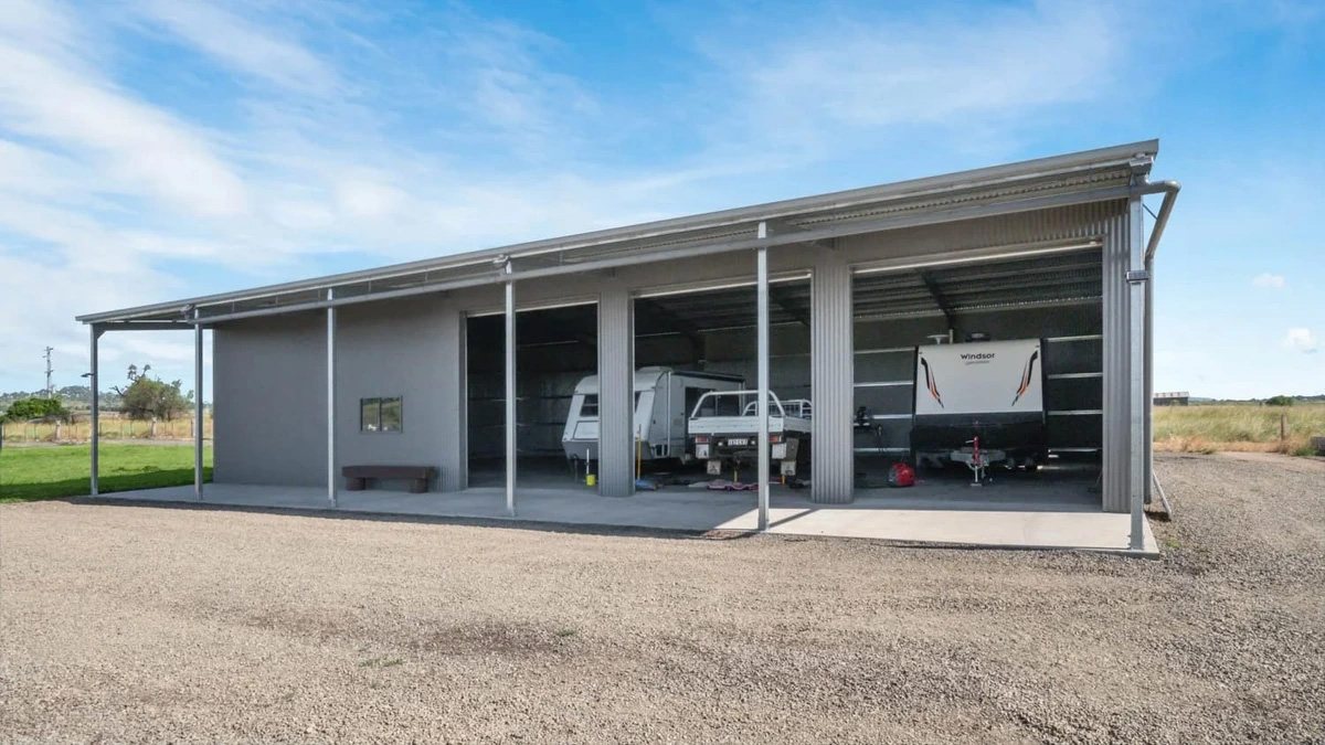 triple caravan shed with rollewr doors open